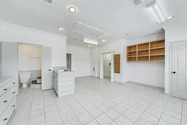 kitchen featuring visible vents, light countertops, and ornamental molding