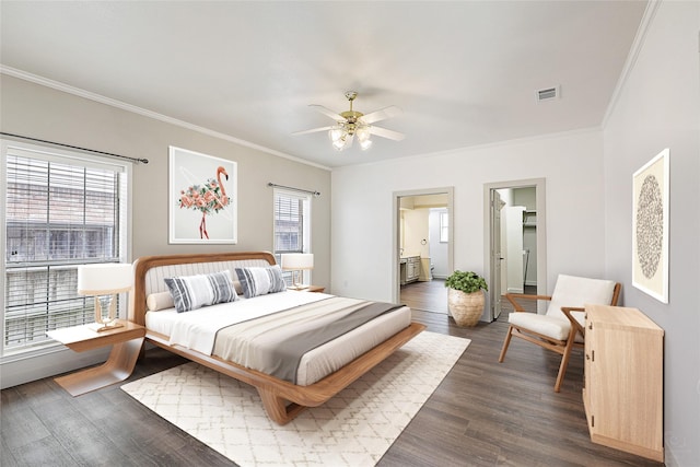 bedroom with visible vents, multiple windows, dark wood finished floors, and crown molding