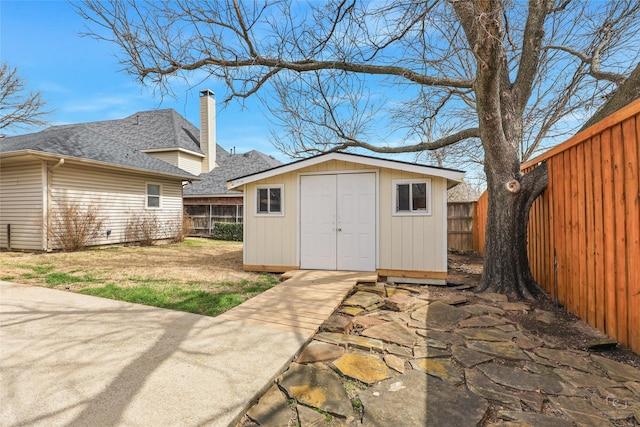 view of outbuilding featuring an outbuilding and a fenced backyard