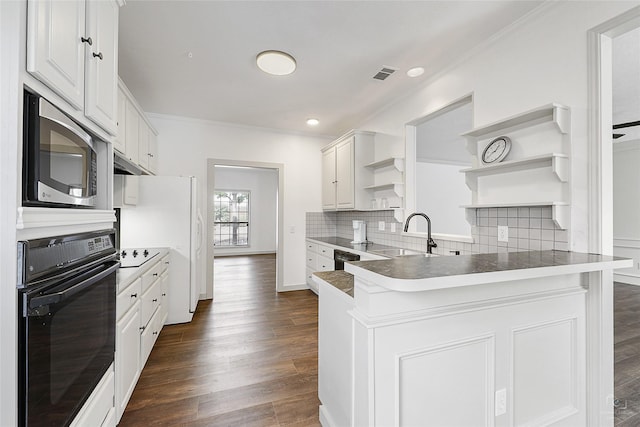 kitchen with visible vents, a peninsula, open shelves, black appliances, and backsplash