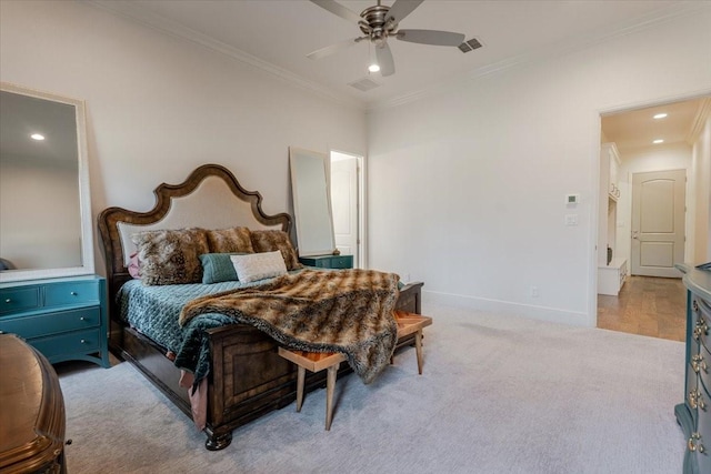 bedroom with visible vents, crown molding, baseboards, light carpet, and recessed lighting