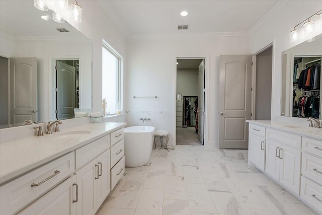 bathroom featuring ornamental molding, visible vents, marble finish floor, and a sink