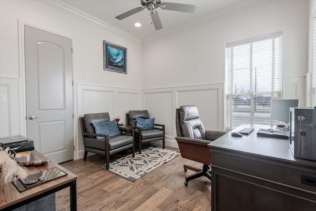 office space with crown molding, ceiling fan, recessed lighting, light wood-style flooring, and a decorative wall