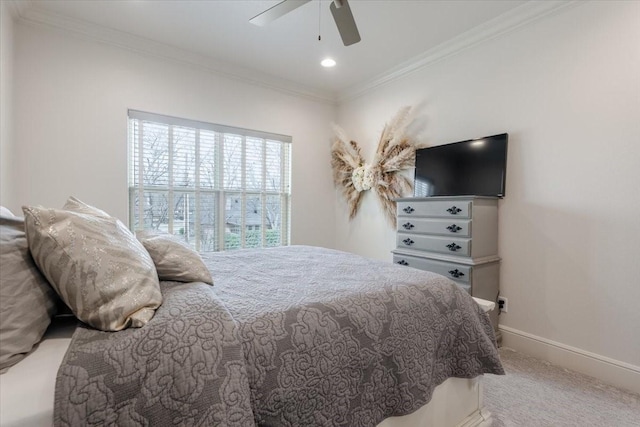 bedroom featuring carpet flooring, ceiling fan, baseboards, and ornamental molding