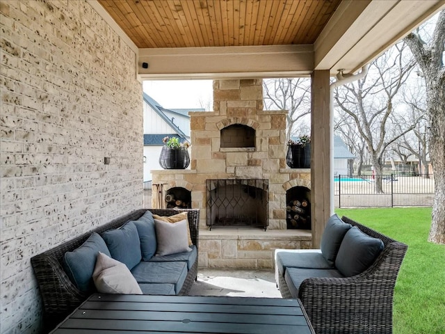 exterior space featuring wood ceiling and an outdoor stone fireplace