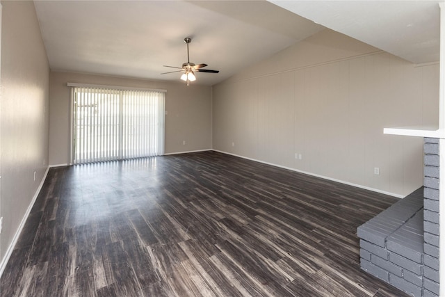 unfurnished living room with dark wood-style floors, baseboards, ceiling fan, and vaulted ceiling