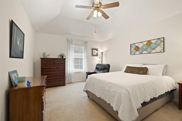 bedroom with light colored carpet, lofted ceiling, and ceiling fan