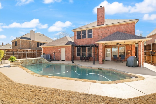 view of pool with a ceiling fan, a fenced backyard, cooling unit, a fenced in pool, and a patio area