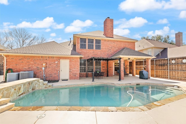 view of swimming pool with central air condition unit, a fenced in pool, and fence