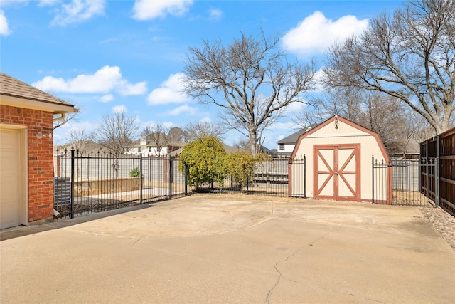 exterior space with a storage shed, fence, and an outbuilding