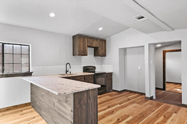 238 Preston Shores Dr, Pottsboro, TX 75076 - kitchen featuring black electric range oven, a sink, dark brown cabinetry, a peninsula, and light wood-style flooring