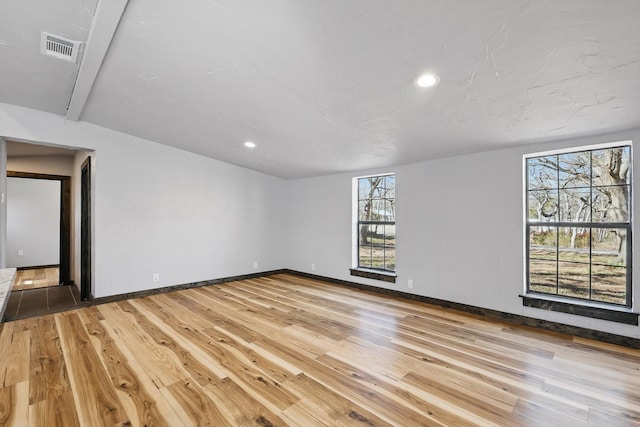 spare room featuring recessed lighting, visible vents, baseboards, and light wood finished floors