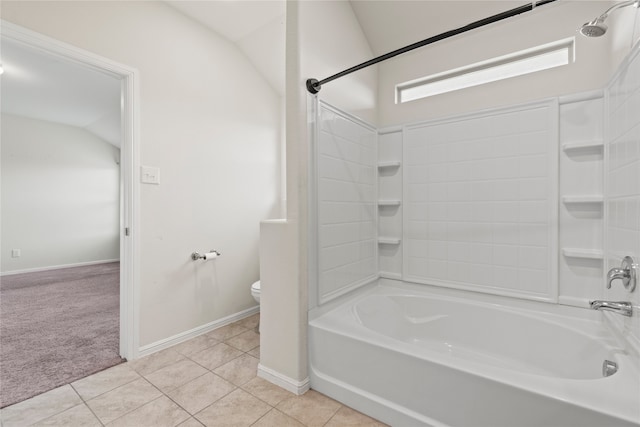 bathroom with tile patterned floors, toilet, tub / shower combination, baseboards, and vaulted ceiling