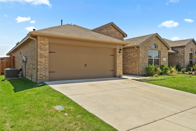 ranch-style house featuring brick siding, cooling unit, and a front yard