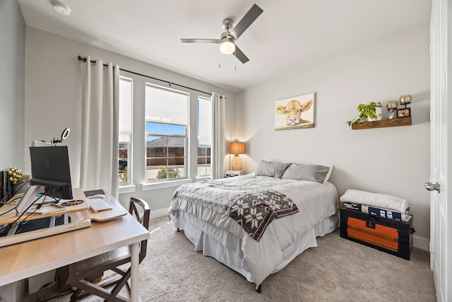 bedroom featuring baseboards, carpet, and a ceiling fan