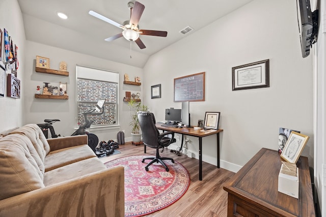 home office with baseboards, visible vents, light wood finished floors, and ceiling fan