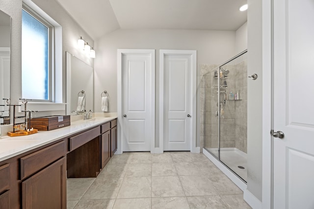 full bathroom featuring a shower stall and vanity