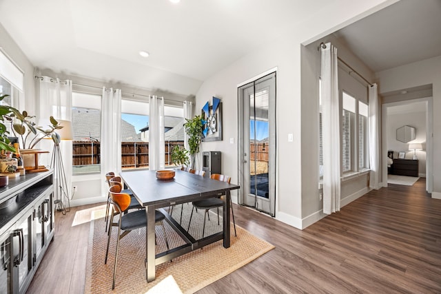 dining area featuring recessed lighting, wood finished floors, and baseboards