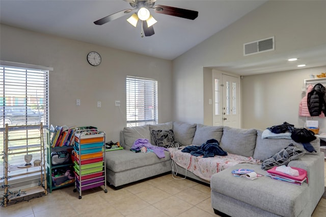 living room featuring visible vents, a healthy amount of sunlight, lofted ceiling, and ceiling fan