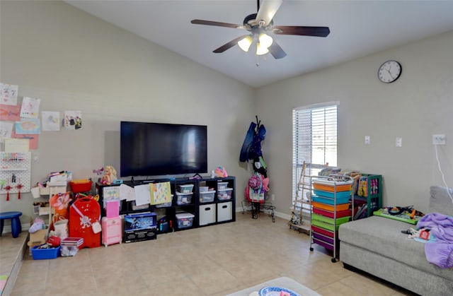 recreation room with baseboards and a ceiling fan