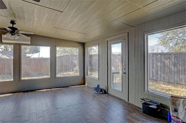 unfurnished sunroom with lofted ceiling, wood ceiling, and ceiling fan