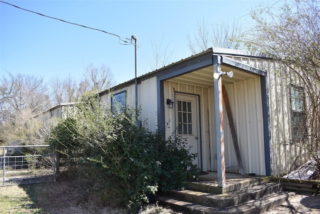 view of outbuilding with fence