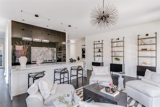 6404 Lakehurst Ave, Dallas, TX 75230 - living room featuring dark wood-style flooring, a chandelier, and baseboards