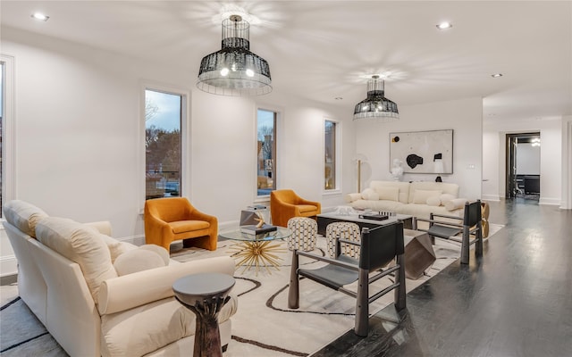 living room featuring recessed lighting, baseboards, and wood finished floors