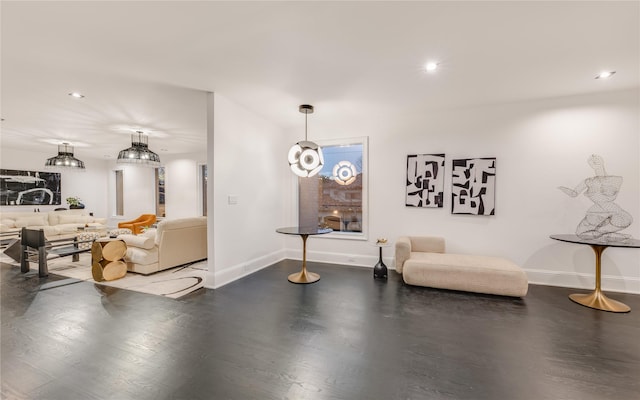 living area featuring recessed lighting and baseboards