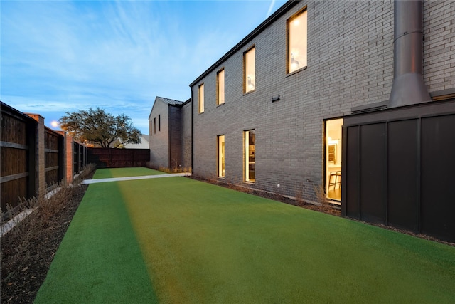 view of yard with a fenced backyard