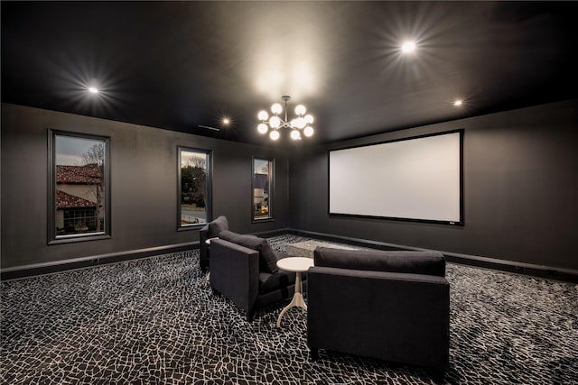 carpeted cinema featuring a notable chandelier, recessed lighting, and baseboards