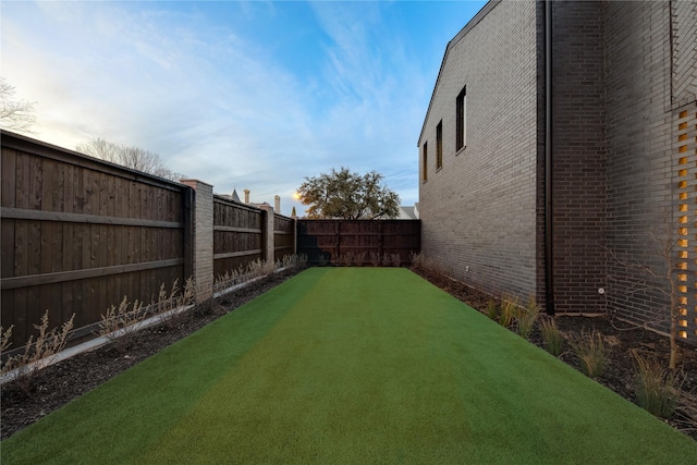 view of yard featuring a fenced backyard