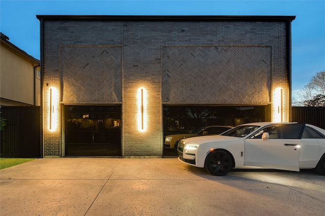 view of front facade featuring a garage and brick siding