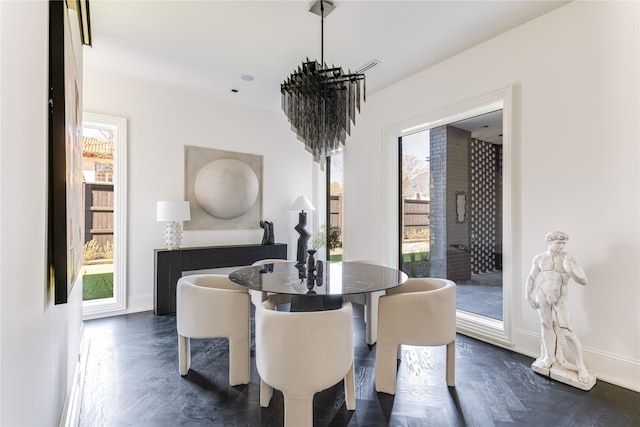 6404 Lakehurst Ave, Dallas, TX 75230 - dining room with a chandelier, baseboards, and dark wood-style flooring