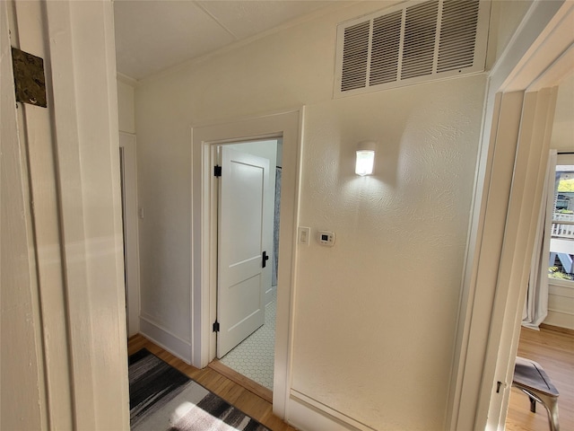 bathroom featuring visible vents and wood finished floors