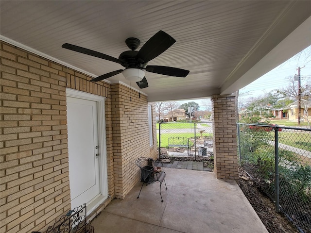 view of patio / terrace featuring a ceiling fan and fence