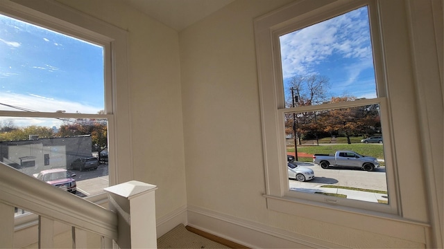 doorway to outside featuring baseboards