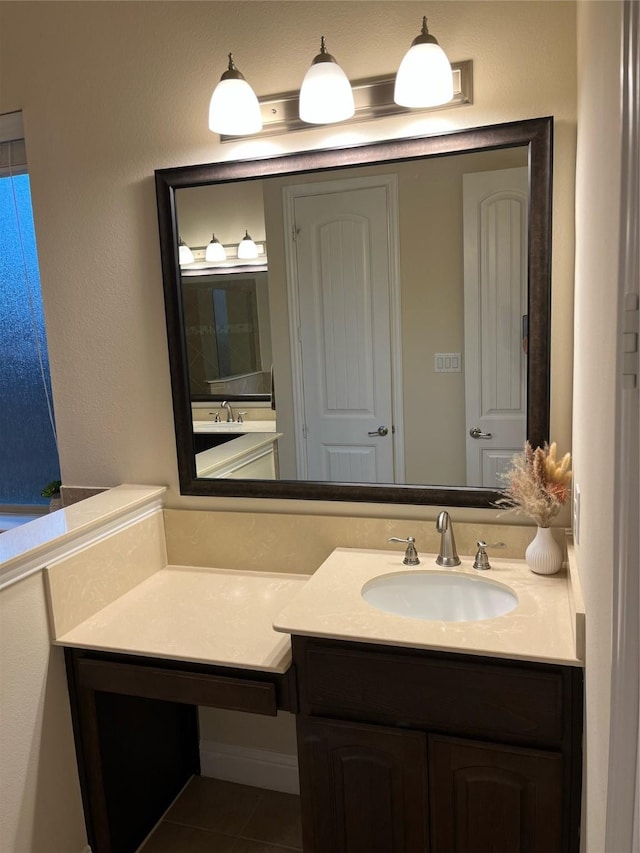 bathroom featuring tile patterned floors and vanity