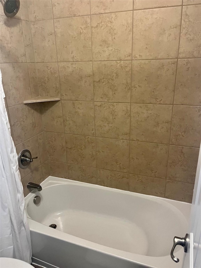 bathroom with shower / bath combo