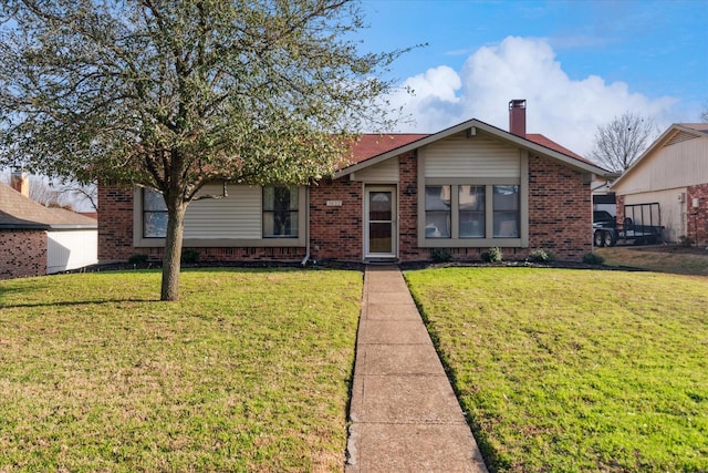 ranch-style house with brick siding, a chimney, and a front lawn