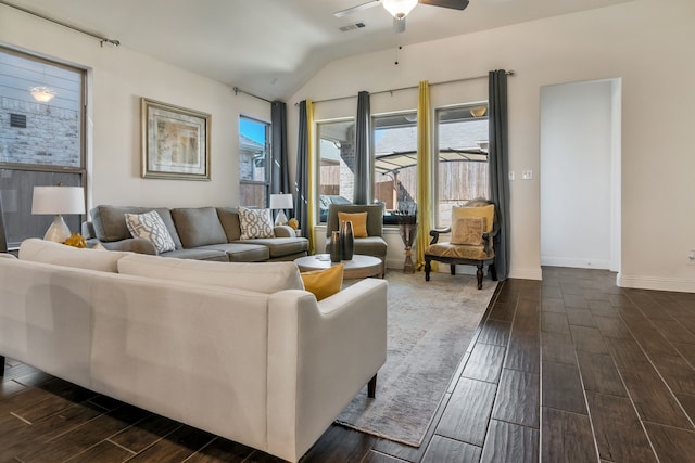 living room with visible vents, baseboards, ceiling fan, wood tiled floor, and vaulted ceiling