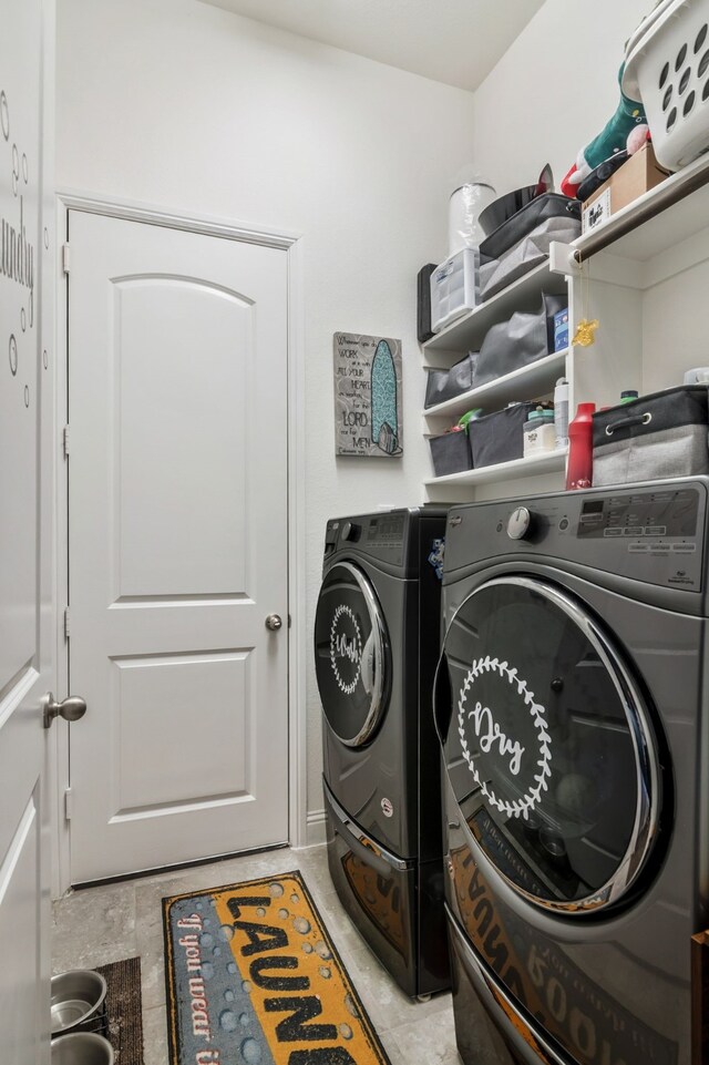 laundry room with washer and dryer and laundry area