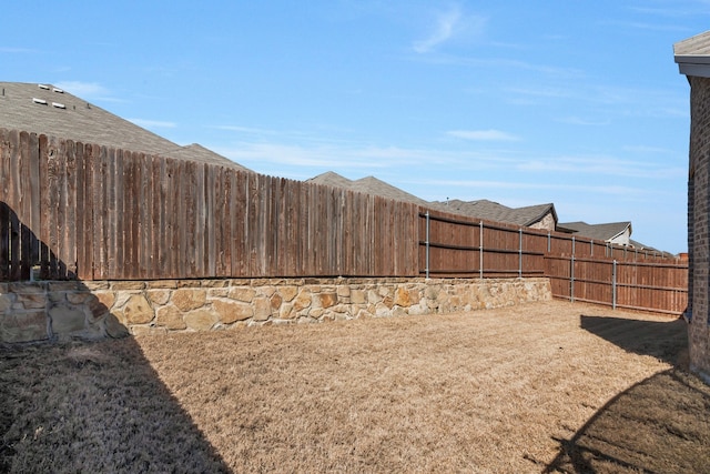 view of yard with a fenced backyard