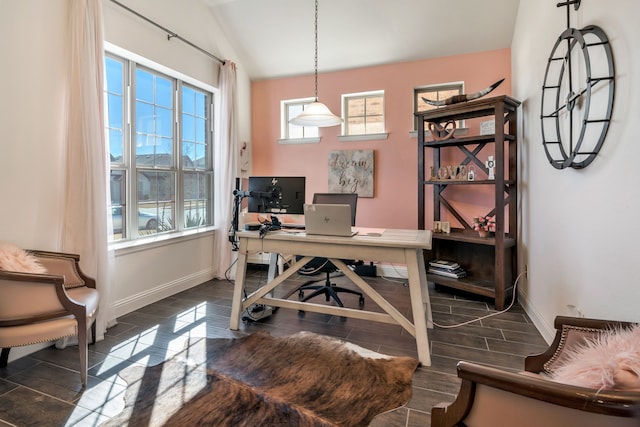 home office with baseboards and lofted ceiling