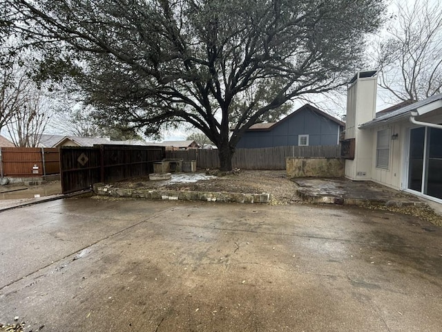 view of yard featuring a patio and a fenced backyard