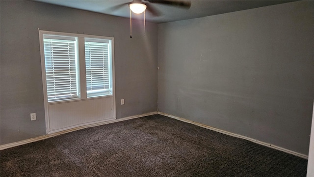 409 E 7th St, Ferris, TX 75125 - unfurnished room featuring ceiling fan and dark colored carpet