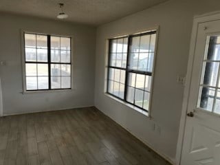 doorway to outside featuring wood finished floors