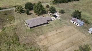 birds eye view of property with a rural view