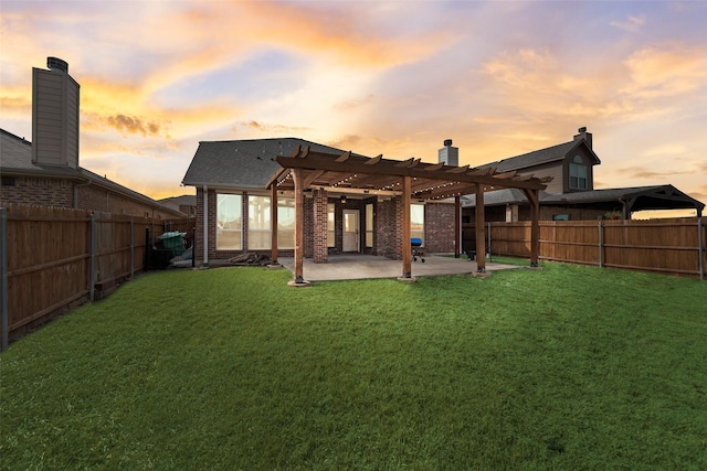 rear view of house featuring a lawn, a pergola, a patio, a fenced backyard, and brick siding