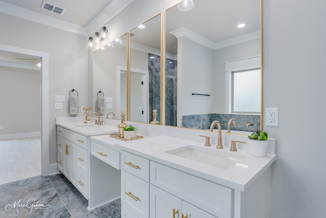 full bath with double vanity, visible vents, crown molding, and a sink